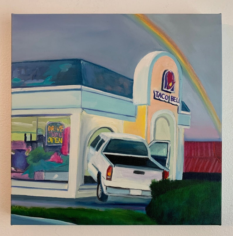 May include: A painting of a Taco Bell restaurant with a white pickup truck pulling into the drive-thru. A rainbow is in the sky above the building. The sign reads "Taco Bell".
