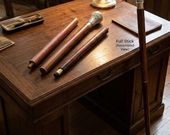May include: A walking stick with a silver-toned ornate handle, shown in three disassembled wooden segments and one fully assembled view. The text "Full Stick (Assembled View)" is printed near the upright walking stick.