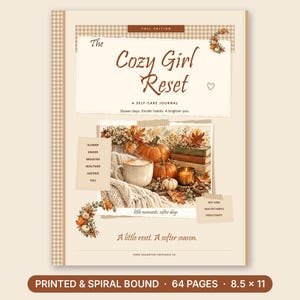 May include: A spiral-bound journal titled The Cozy Girl Reset, featuring a beige cover with a brown gingham border. The cover displays autumn-themed illustrations of pumpkins, a mug, and books, with text including Slower days, Kinder habits, A brighter you, and printed dimensions of 8.5 x 11 inches.