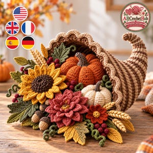 May include: A crocheted cornucopia overflowing with autumn-themed items including a large orange pumpkin, a smaller white pumpkin, a yellow sunflower, a red dahlia, green leaves, wheat stalks, small red berries, and brown acorns.