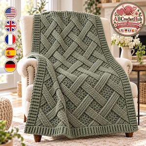 May include: A sage green crochet blanket featuring a prominent woven lattice pattern with a thick ribbed border. The blanket is draped over a beige upholstered armchair. A circular logo in the top right corner reads AB Crochet Hub.