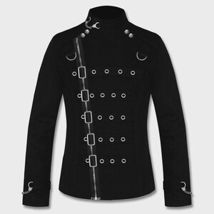 May include: A black long-sleeve jacket featuring a high collar, a diagonal front zipper, and five horizontal straps with silver-toned buckles and metal eyelets. The jacket includes small silver chain accents at the collar and cuffs.