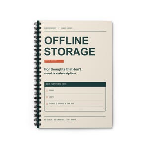 May include: A spiral-bound notebook with a cream-colored cover featuring dark green text that reads OFFLINE STORAGE, a red rectangular accent, and the text For thoughts that don't need a subscription. It includes a section labeled SAVE SOMETHING HERE.