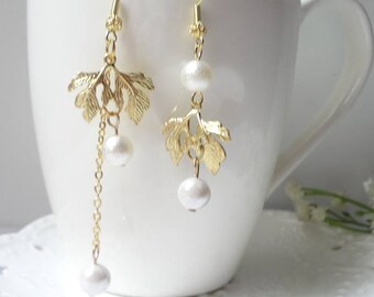 Hand made asymmetrical female contracted leaf pearl earring drop 0497