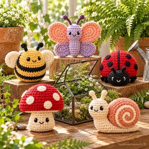 May include: A collection of five crocheted plush toys including a yellow and black bee, a purple and peach butterfly, a red and black ladybug, a red and white mushroom, and a cream and peach snail, all featuring embroidered smiling faces.