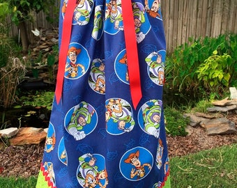 A boutique pillowcase dress featuring Toy Story Size 18-24 months only; CH087