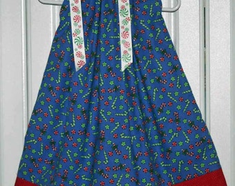 Boutique Pillowcase dress featuring Red and Green candy canes on a blue background Size 3T Only:CD024