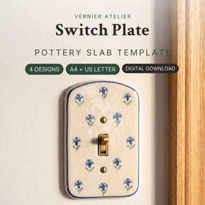 May include: A ceramic switch plate with a cream-colored glaze and a repeating pattern of small blue flowers. The rectangular plate features rounded top corners, a blue border, and a brass toggle switch. Text reads: VERNIER ATELIER Switch Plate POTTERY SLAB TEMPLATE 4 DESIGNS A4 + US LETTER DIGITAL DOWNLOAD.
