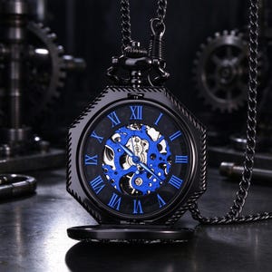 May include: A black octagonal pocket watch with a skeleton dial featuring bright blue Roman numerals and exposed mechanical gears. The watch includes a matching black metal chain attached to the top crown, showcasing a dark metallic finish.