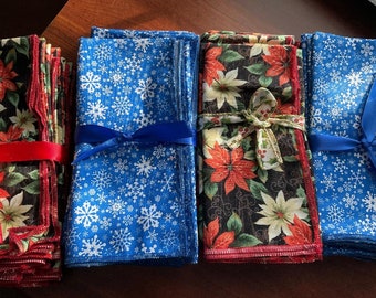 Set of 6 of  blue  or red Christmas dinner napkins. 24.99 per set , size is 15"x 15.Cotton fabric. Great gift. Custom made.