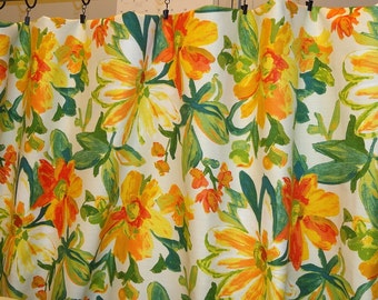 Floral Mill Creek fabric by the yard. Orange yellow flowers with a green leaves on white background.100% cotton.