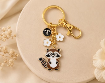 Raccoon Keychain – Personalized 3D Enamel Bag Charm with White Flowers and Initial