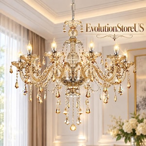 May include: A multi-tiered amber crystal chandelier featuring numerous dangling teardrop-shaped crystals, curved glass arms, and eight candle-style light bulbs. The fixture is suspended by a metal chain and displays the text EvolutionStoreUS.