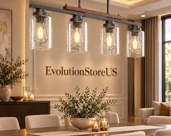 May include: A linear pendant light fixture featuring four cylindrical seeded glass shades suspended from a matte black metal frame with a dark wood accent bar. Each shade houses an Edison-style light bulb emitting a warm glow.