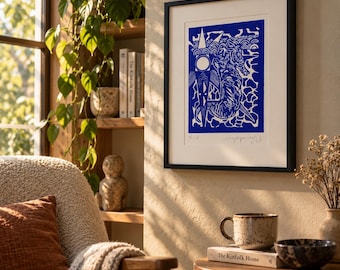 May include: A framed art print featuring a blue and white linocut illustration of a seahorse surrounded by geometric shapes and wave patterns. The print is matted in white with a black frame and includes a handwritten signature and edition number.