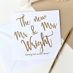 White square card with gold text: The new Mr & Mrs NAME congratulations!