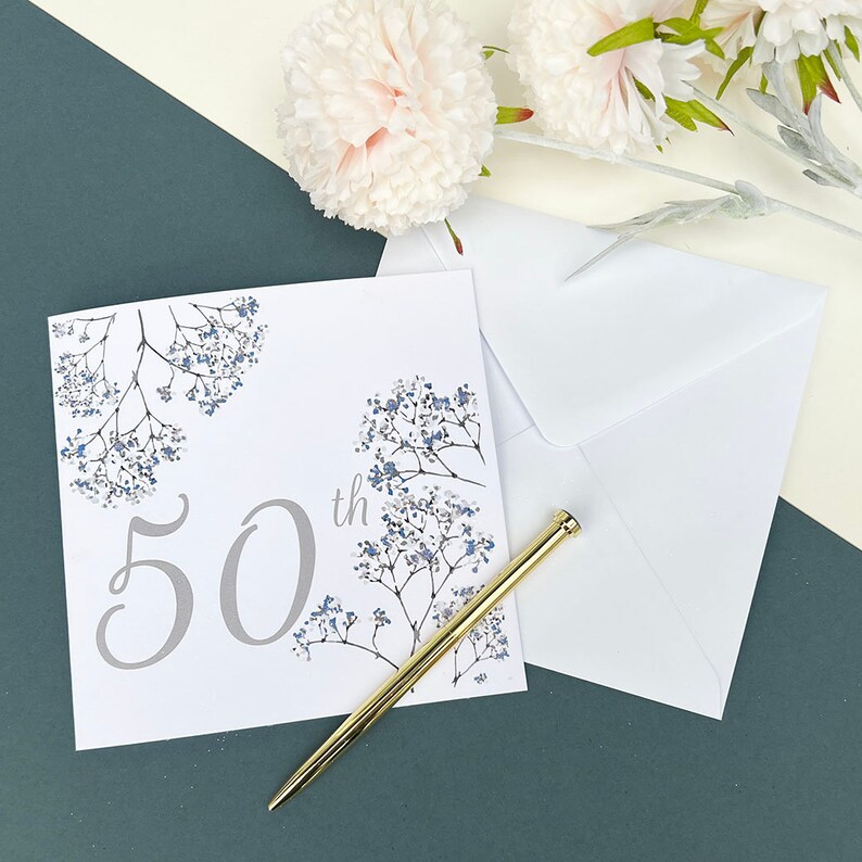 Square white card with pretty blue and grey flowers with 50th written in grey