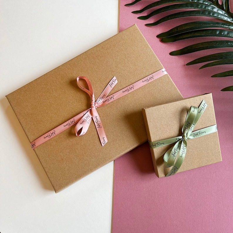 Kraft gift boxes with branded pink or green ribbon, comes in all different sizes and can add to order for an additional charge