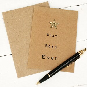 Kraft card with gold glitter star at the top and black text: best boss ever