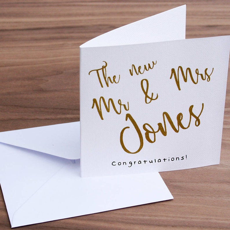 White square card with gold text: The new Mr & Mrs NAME congratulations!