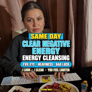 May include: A person wearing a dark grey sweatshirt sits behind a table with tarot cards laid out in a row. Text overlay reads: SAME DAY CLEAR NEGATIVE ENERGY ENERGY CLEANSING EVIL EYE HEAVINESS BAD LUCK I LOOK I CLEAR YOU FEEL LIGHTER PSYCHIC INSU.