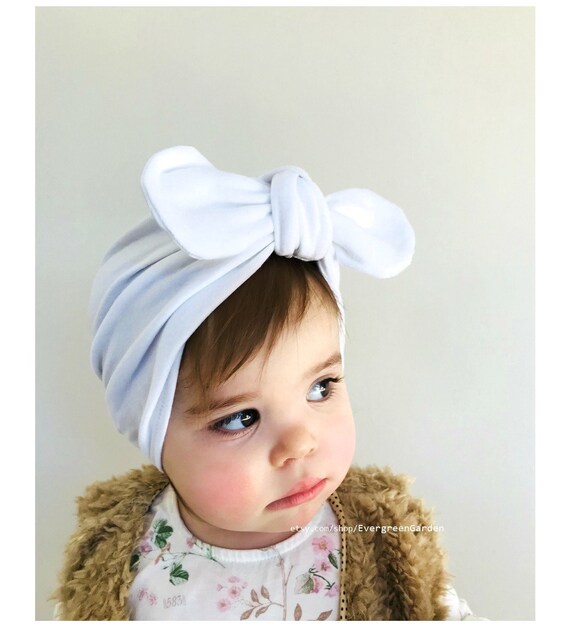 white newborn hat with bow
