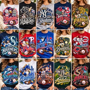 May include: A collection of fifteen t-shirts featuring various Major League Baseball team logos, mascots, and city-themed graphics. Each shirt displays vibrant, detailed illustrations of players, baseball equipment, and iconic stadium landmarks.