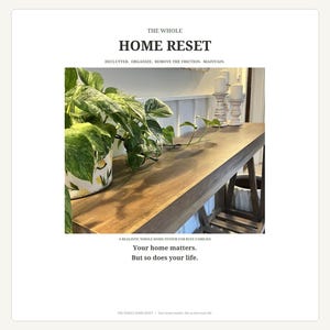 May include: A long wooden console table with a potted green and white variegated plant on the left and two white pillar candles on the right. The text reads THE WHOLE HOME RESET, DECLUTTER, ORGANIZE, REMOVE THE FRICTION, MAINTAIN, Your home matters, But so does your life.
