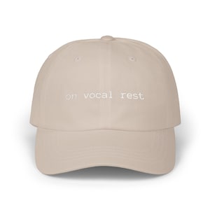 on vocal rest. dad hat.