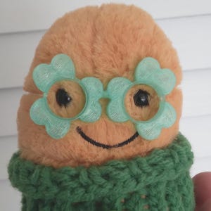 May include: A set of three ceramic nesting bowls in shades of blue, green, and white. The bowls have a speckled glaze and a simple, modern design. The largest bowl is approximately 15 cm in diameter.