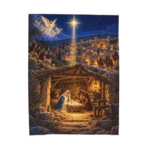 May include: A rectangular wall tapestry depicting a nativity scene with a central stable housing a family, a cow, and a donkey. Above, a bright star shines over a distant city, while angels appear in the night sky. The scene features warm lighting.