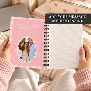 May include: A spiral-bound notebook with a pink and white checkered border. The left page features a custom oval photo of three people and printed text. The right page is lined. A black overlay box reads: ADD YOUR MESSAGE & PHOTO INSIDE.