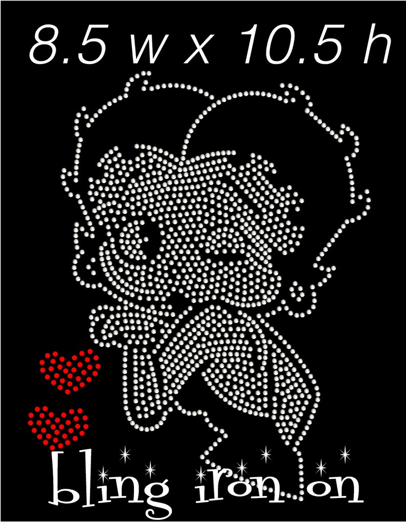 May include: Black iron-on transfer featuring a cartoon character design made of white rhinestones. Two red heart shapes are on the left. The text "bling iron on" is at the bottom. The design measures 8.5 inches wide by 10.5 inches high.