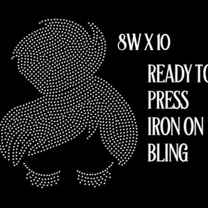 May include: Iron-on rhinestone design of a woman's face with closed eyes and eyelashes. The design is 8 inches wide by 10 inches tall. The text "READY TO PRESS IRON ON BLING" is also included.
