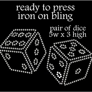 May include: A pair of silver iron-on bling dice, each measuring 5 inches wide by 3 inches high. The dice are made of rhinestones and are ready to press.