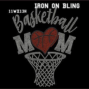 May include: Iron-on bling design featuring the words "Basketball Mom" with a red heart-shaped basketball and a basketball hoop. The design is made of rhinestones.