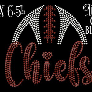 May include: Iron-on rhinestone design featuring a football helmet and the word "Chiefs" in red rhinestones. The design measures 7 inches wide by 6.5 inches high.