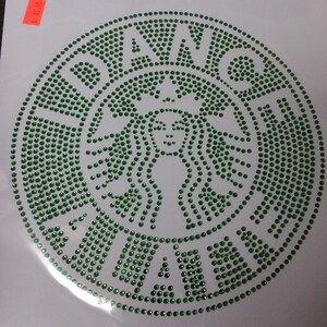 May include: Green rhinestone iron-on patch with the Starbucks logo, featuring a mermaid with a crown and the word "Starbucks" around the outside.