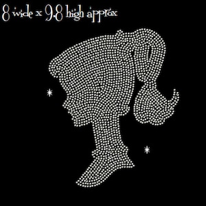 May include: A rhinestone silhouette of a woman's profile, with her hair in a ponytail, on a black background. The design is approximately 8 inches wide and 9.8 inches high. Two small star shapes are near the silhouette.