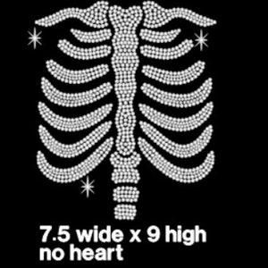 May include: White rhinestone design of a ribcage with three small stars. The design is 7.5 inches wide and 9 inches high. No heart.