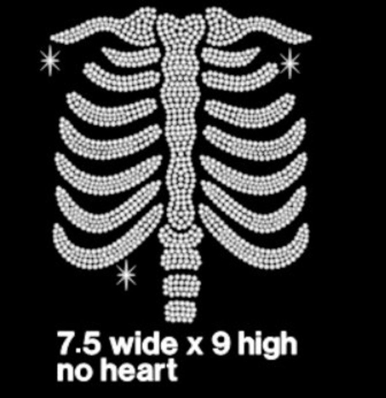 May include: White rhinestone design of a ribcage with three small stars. The design is 7.5 inches wide and 9 inches high. No heart.