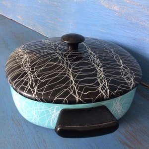Enamel. Turquoise enamel. Chromoveil cookwares by Melmede Serendipity turquoise and black pot. Mid Century enamel cooking ware.