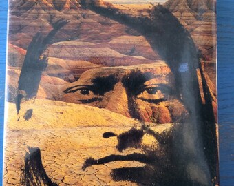 May include: The cover of a book titled "The Native Americans: An Illustrated History". The cover features a close-up of a Native American man's face, with a desert landscape in the background.