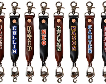 May include: Eight leather keychains in brown and black, each featuring a metal swivel clasp at the top and a spring-loaded clip at the bottom. Each strap is personalized with a name: James, Collin, David, Neo, Rylan, Mason, Carter, and Brady.