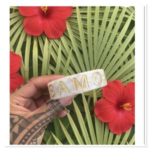 White TS acrylic faux tortoise shell design polynesian bangle cuff Samoa Hawaii bracelet approx. 3/4 inch wide. All sales final