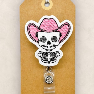 cute skeleton head with a pink cowboy hat embroidered badge reel cover
