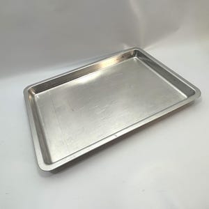 Rectangular Metal Baking Sheet with Raised Edges and Embossed Bottom