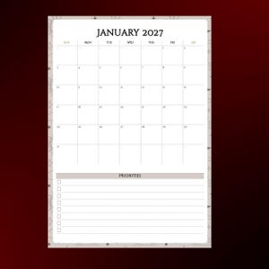 Op de afbeelding: Een maandkalenderpagina voor januari 2027 met een rasterindeling voor data, voorzien van een sectie met het label Priorities met een checklist van lege vakjes en horizontale lijnen. De rand is versierd met kleine zon- en sterpictogrammen.