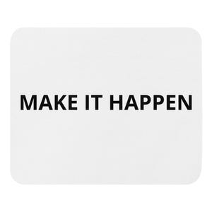 May include: A rectangular white mouse pad with rounded corners featuring the text "MAKE IT HAPPEN" printed in bold, black, sans-serif capital letters centered on the surface. The design is clean, simple, and functional for computer use.