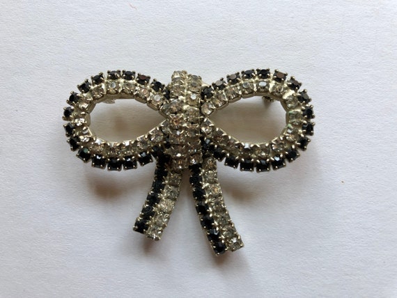 Vtg Black & Clear Rhinestone Bow Form Brooch - image 1